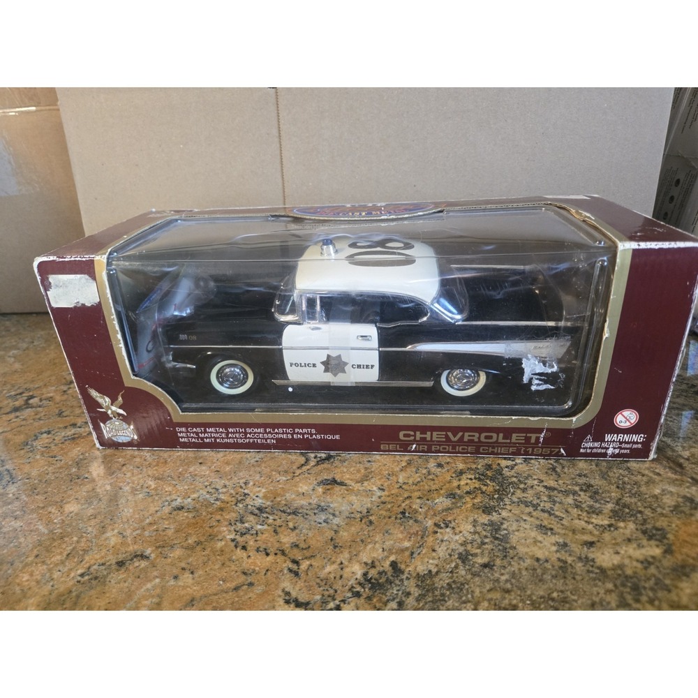 PRE-OWNED ROAD LEGENDS 1957 CHEVROLET® BEL AIR POLICE CHIEF 1:18 DIECAST W/STAND
